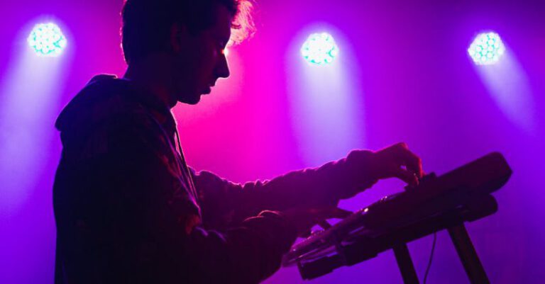 Indie Brands - Man holding DJ mixer machine