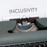 Inclusivity - White Paper with Text on Green Vintage Typewriter