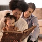 Storytelling - Photo of Woman Holding Brown Book With Her Child