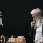 Strategic Alliances - Elderly Man Thinking while Looking at a Chessboard