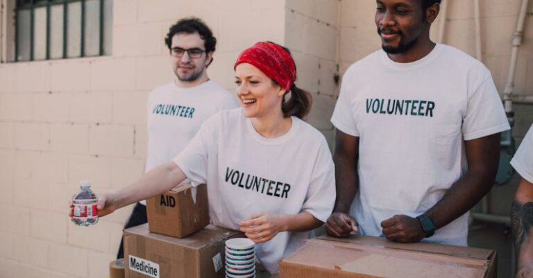 Social Impact - Three People Donating Goods