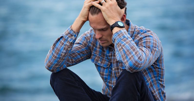 Failure - Man in Blue and Brown Plaid Dress Shirt Touching His Hair