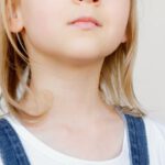 Innovative Thinking - Girl Looking Upwards While Holding Her Artwork