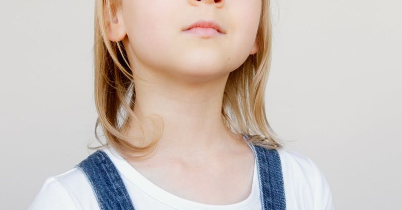 Innovative Thinking - Girl Looking Upwards While Holding Her Artwork