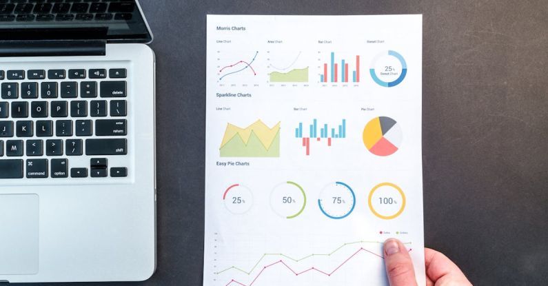 Analytics - Person Holding Chart And Bar Graph