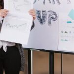 Socially Responsible Investments - Woman in Gray Coat Holding White Printer Paper