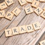 Tariffs - Trade and trade related words on wooden table