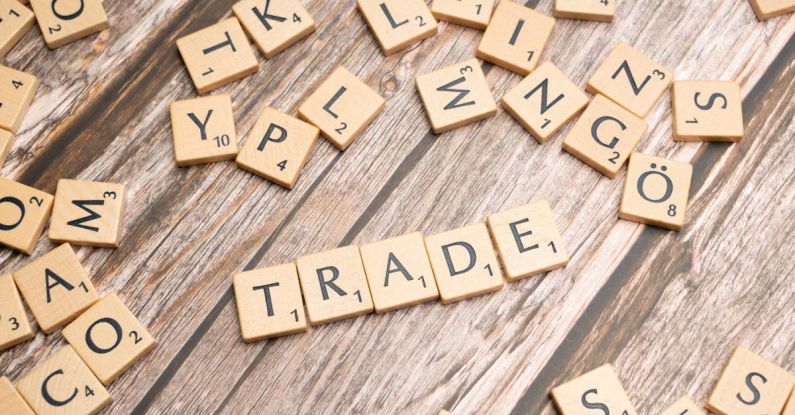 Tariffs - Trade and trade related words on wooden table