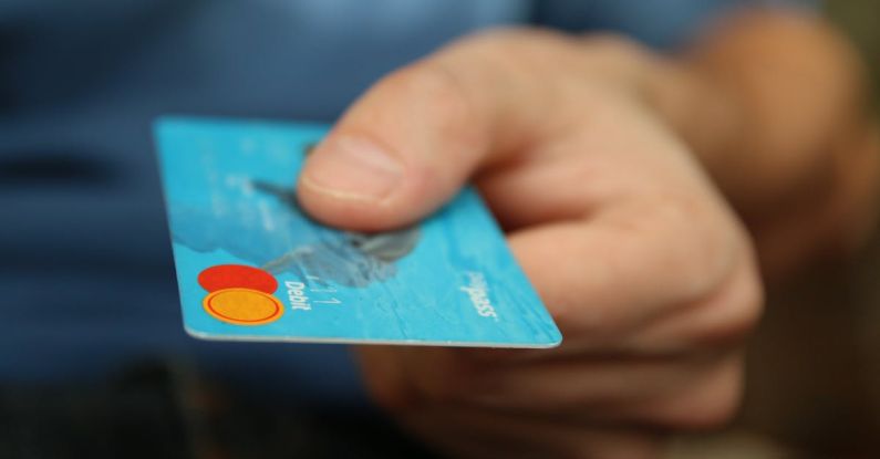 Business Debt - Person Holding Debit Card