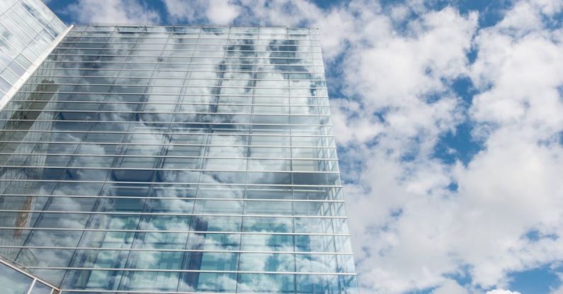 Transparency - Bottom View of Clear Glass Building Under Blue Cloudy Sky during Day Time