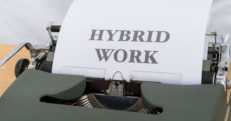 Workforces - A typewriter with the words hybrid work on it