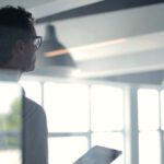 Creative Leader - Formal man with tablet giving presentation in office